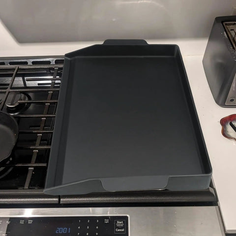 17 By 13 Inch Cast Iron Griddle For Gas Grills And Stovetops on kitchen stove, universal grill pan for camping and tailgating.