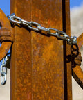 Heavy Duty 3/16 Inch 304 Stainless Steel Chain, 32.8 Feet Rustproof Utility Chain securing a rusty metal gate outdoors.