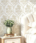 Beige Floral Peel And Stick Wallpaper With Delicate Arched Accents in a cozy bedroom setting with bedside decor.