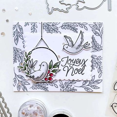 Handmade card with birds, holly, and 'Joyeux Noel' text using Rectangle Frame Metal Die Cuts Set With Scalloped Edges And Stitched Nesting Tags.