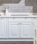 Kitchen with white cabinets featuring Vintage Rosette Sunburst Cabinet Knobs In Champagne Bronze Finish, 30 Pack, One And A Quarter Inch Diameter, Solid Zinc Alloy Kitchen Cabinet Pulls, Drawer Knob Set For Cabinets, Vanities And Dressers.