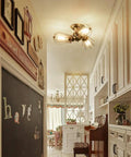 Vintage Industrial Ceiling Light With Metal Wire Cage Shade installed in hallway, rustic bronze finish, semi flush mount