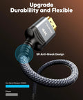 Close-up view of braided HDMI 4K cable with gold-plated connectors and looped nylon braid.