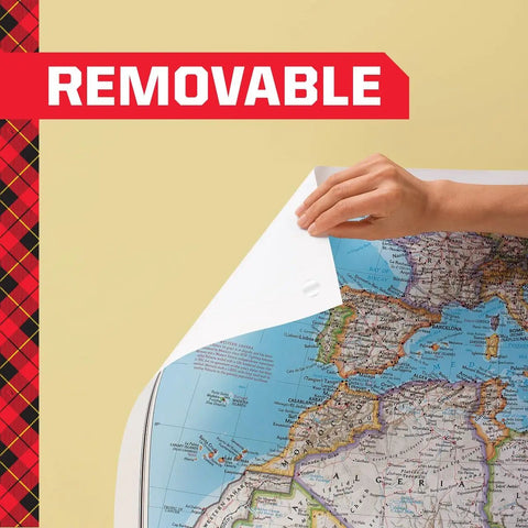 Hand peels map off wall using Removable Poster Tape With Dispenser, Handy Three Quarters Inch Wide By 12.5 Feet Clear Double Sided Adhesive