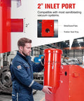 Technician inspects 2-inch inlet of Beast 1.6 HP Industrial Dust Collector With 1.8 Gallon Tank Universal Fit For Sandblasting Cabinets