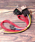 Air Horn Relay Wiring Harness Kit 12V 80A for cars trucks and motorcycles with 4 pin relay and copper contacts on wood surface