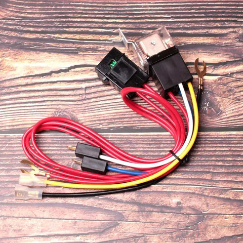 Air Horn Relay Wiring Harness Kit 12V 80A for cars trucks and motorcycles with 4 pin relay and copper contacts on wood surface