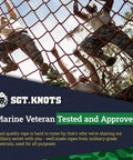 Marine veterans testing and approving military-grade ropes for durability and quality in outdoor climbing exercise.