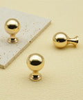 10 Pack Polished Gold Ball Cabinet Knobs Set 1 Inch Diameter Zinc Alloy Dresser Drawer Handles on light surface