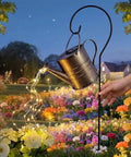 Solar Powered Watering Can Fountain With Cascading Warm White Fairy Lights For Outdoor Gardens And Yards in garden setting