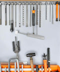 Wall-mounted tool rack with various tools and a Quiet Close Trash Can Lid Damper Kit 6 Pack 55 to 59 Newtons displayed.