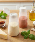 Top Shelf Soft Parmesan Cheese Shaker Set Squeezable Spice Jars With Wide Opening Heavy Duty Plastic Seasoning Dispensers on wooden table.
