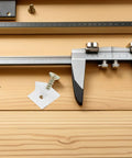 Heavy Duty Furniture Shelf Brackets Set 50 Pieces with screws, metal caliper, and white plastic on wooden surface