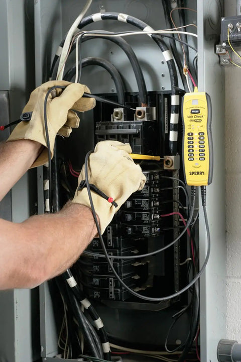 Person using Voltage And Continuity Tester With Non Contact AC Detection 50 600V AC Range DC Polarity Indication Twin Probes