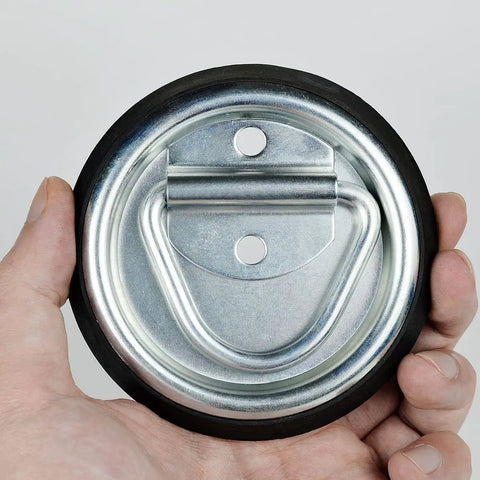 Heavy Duty D Ring Tie Down Anchors Four Inch Flush Surface Mount Hardware Four Pack For Trailers Trucks And Pickup Campers Hella Tough With Two Thousand Lbs Breaking Strength Secure Your Rig Solid Now, showing the galvanized steel base and rubber edge.