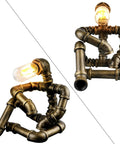 Steampunk Robot Table Lamp With Vintage Industrial Water Pipe Design For Bedside Nightstand, rustic bronze finish, quirky desk light