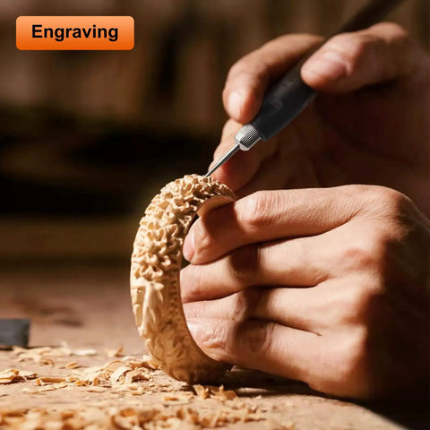Close-up of hands using 141-Piece Rotary Tool Accessories Kit With 1/8-Inch Shank Universal Fitment for engraving wood