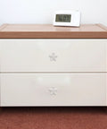 Wooden dresser with white drawers featuring Star Shaped Ceramic Cabinet Pull Handle White Knob For Wardrobe And Dresser Drawers Smooth Ergonomic Grip Vintage Style Drawer Pull For Kitchen And Furniture.