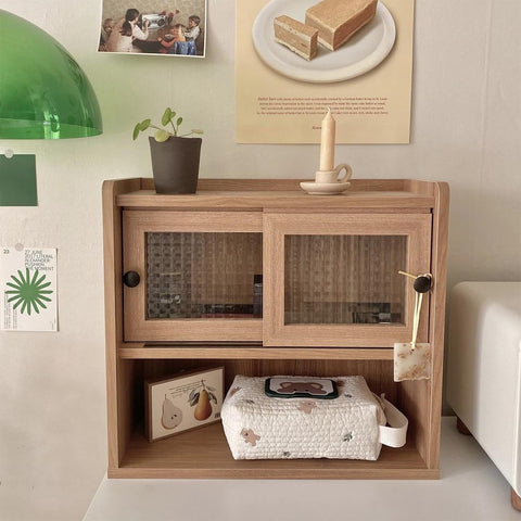 Compact Wet Wipe Organizer for Diapers and On The Go Essentials on shelf with decorative items in cozy room setting.