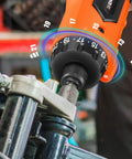 Close-up of 8V Cordless Screwdriver Kit With 82 Piece Accessory Set, 10Nm Max Torque, adjusting a bolt on machinery