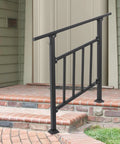 Built Like A Tank 3 Step Outdoor Stair Railing In Matte Black Steel Alloy with safety fence installed on brick steps.