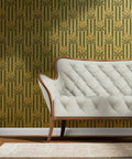 Top Shelf Dandelion Olive And Rich Gold Metallic Wallpaper Featuring A Luxe Fibrous Texture and that Premium Glow Everyone Loves Eco Certified Wallcovering Built Right Here In The USA For Your Next Home Upgrade with green and gold floral pattern behind a white tufted sofa.