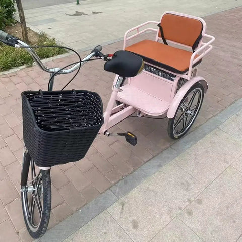 Hassle Free Fold Tandem Tricycle For Adults And Seniors With Rear Bucket Seat And Locking Safety Strap 20 Inch Front Wheel Heavy Duty Steel Frame Bright Pink Chill City Cruisers side view with black basket.