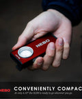 Person holding Slim 6694 Red Rechargeable Flashlight Delivers 500 Lumens Of Bright COB LED Power with compact design