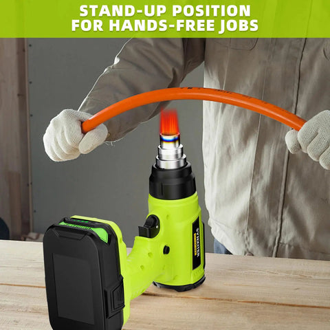 Cordless 18V Heat Gun With 350W Power, LED Light, Quick Heat In Seconds, Variable Temperature 120 To 122°F, Includes 4 Nozzles And Scraper, Low Voltage Protection, Great For Crafts And DIY Projects Battery Not Included. Stand-up cordless heat gun heating orange tubing.