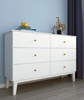 White dresser against blue wall, decorated with books and vase, emphasizing White Contact Paper Peel And Stick Wallpaper For Cabinets And Walls Self Adhesive Matte Vinyl Wrap Thick Durable Film Removable Grid Printed Back For Easy Cuts 30 By 120 Inches on wall surface.