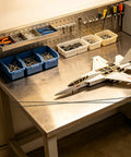 RC plane on workbench with Ten Pack Carbon Fiber Wing Spar Poles for RC Planes Heavy Duty High Strength Structural Rods for Gliders