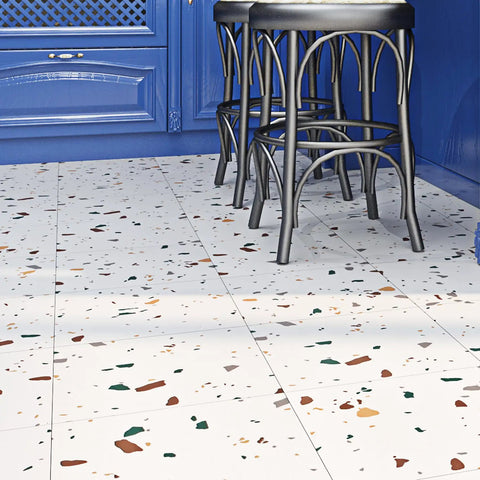 Colorful terrazzo peel and stick floor tiles in kitchen with blue cabinets and black stools, 12x12 inch, renter friendly, easy install.