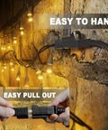60 Foot Outdoor Extension Cord Black 16 AWG SJTW Heavy Duty 3 Prong Power Cable in use with string lights on brick wall