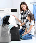 Family using 2 Pack Travel Laundry Bags With Handles And Aluminum Carabiner Dirty Clothes Organizer For Travel Camp Gym And Students Upgraded With Hanging Hooks Lightweight Yet Sturdy 24 By 21 Inches