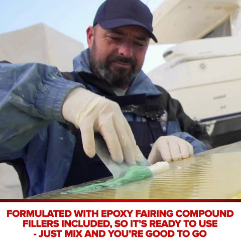 Man applying Ready Mix Epoxy Fairing Compound One Gallon Heavy Duty Formula on boat hull for smooth finish.