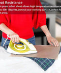 Person using iron with 3 Pack PTFE Sheets For Heat Press 16x12 Inches Non Stick Reusable Craft Mat on table