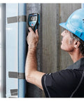 Tough As Nails Stud Finder And Wall Scanner High Precision Metal Detector used by a worker on concrete wall.