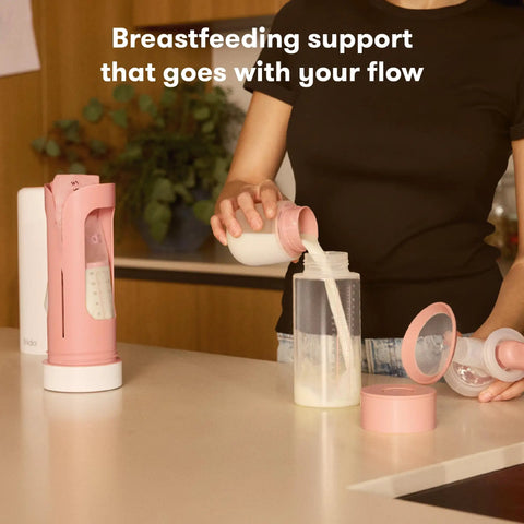 Definitely A Game Changer For Pumping Moms Reusable Breast Milk Cooler Ice Packs in use, pouring milk into a container.