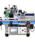 Lay Off The Manual Grind With This Automatic Round Bottle Labeling Machine Featuring A HighSpeed QuickPrint Encoder And Smooth Conveyor For 15 To 39 Inch Bottles, showcasing the labeling mechanism and control panel.