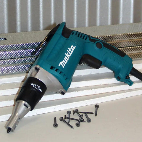FS2200 2500 RPM Drywall Screwdriver With Lightweight 3.5 lb Design, visible on workbench with screws