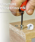 White Furniture Shelf Support Pegs Cam Lock Fasteners With Cabinet Connectors For Hidden Shelf Brackets And Wardrobe Panel Assembly 30 Piece Set being installed with a screwdriver.