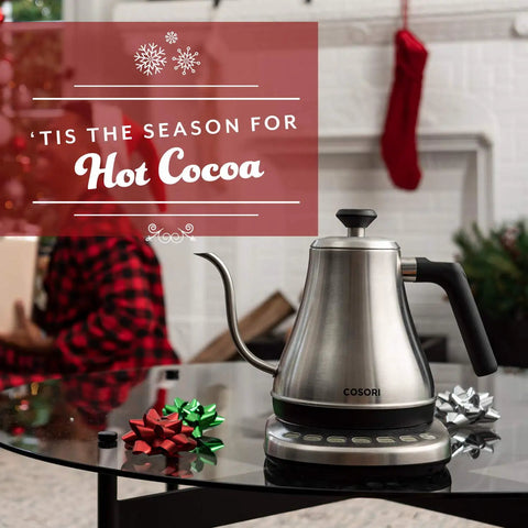 Cosori Gooseneck Electric Kettle 0.8 Liters Silver Precision Pour Over Coffee And Tea Maker on a table with holiday decor.