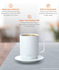 Keep Your Morning Brew Piping Hot With This App Controlled Smart Mug 10 Ounce White Heated Coffee Cup featuring a mug on a charging coaster.