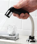 Heavy Duty Black Replacement Kitchen Sink Sprayer With Hose And Guide in use, featuring high pressure thumb trigger for faucet.