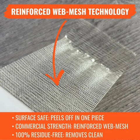Close-up of Double Sided Carpet Tile Tape 2 In By 90 Ft Heavy Duty With Reinforced Web Mesh on wood surface.
