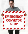 Rock Solid Emergency Conveyor Stop Sign, 24X30 Inch Heavy Duty Industrial Warning Plaque held by a man with red and white stripes.
