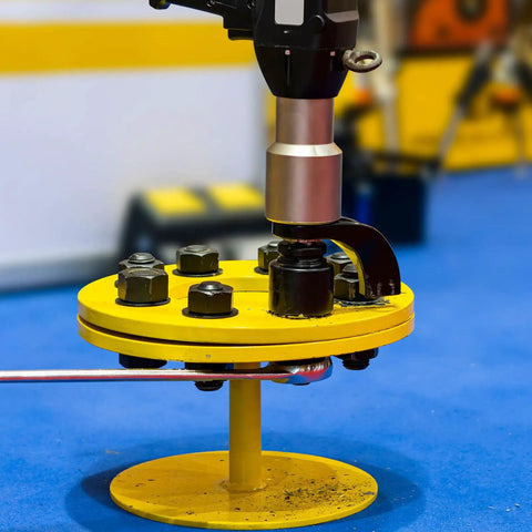 Internal Tooth Lock Washer Assortment Kit being used with bolts on a yellow circular fixture for mechanical assembly.