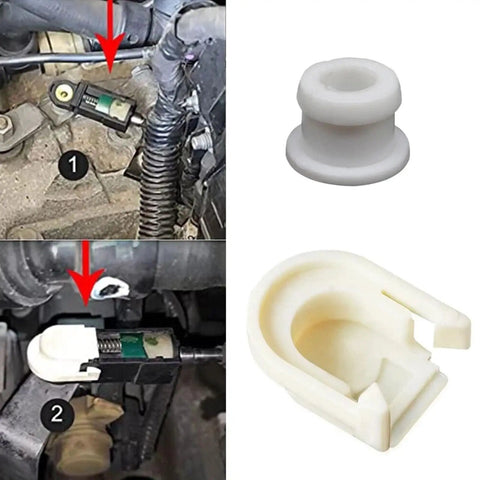 Gearhead Grade Transmission Shifter Adjuster Cable Head CV617C445AA For Maximum Power And Smooth Shifts Built From High Strength Alloy And Wear Resistant Polymer Lab Tested Thermal And Mechanical Toughness Keeps Cable Tension In Check. White transmission shifter cable head, plastic and alloy, shown installed.