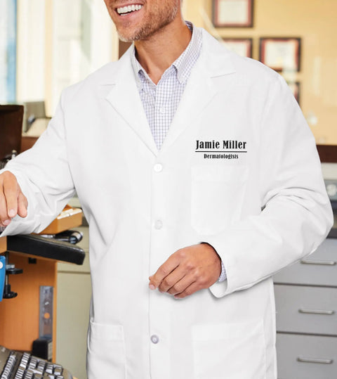Person wearing personalized embroidered lab coat, Jamie Miller, for men, 42 inch length, custom name text, in medical setting.
