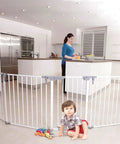 Royale Converta 3 In 1 Play Yard And 151 Inch Wide Baby Gate, 6 configurable panels around child in modern kitchen